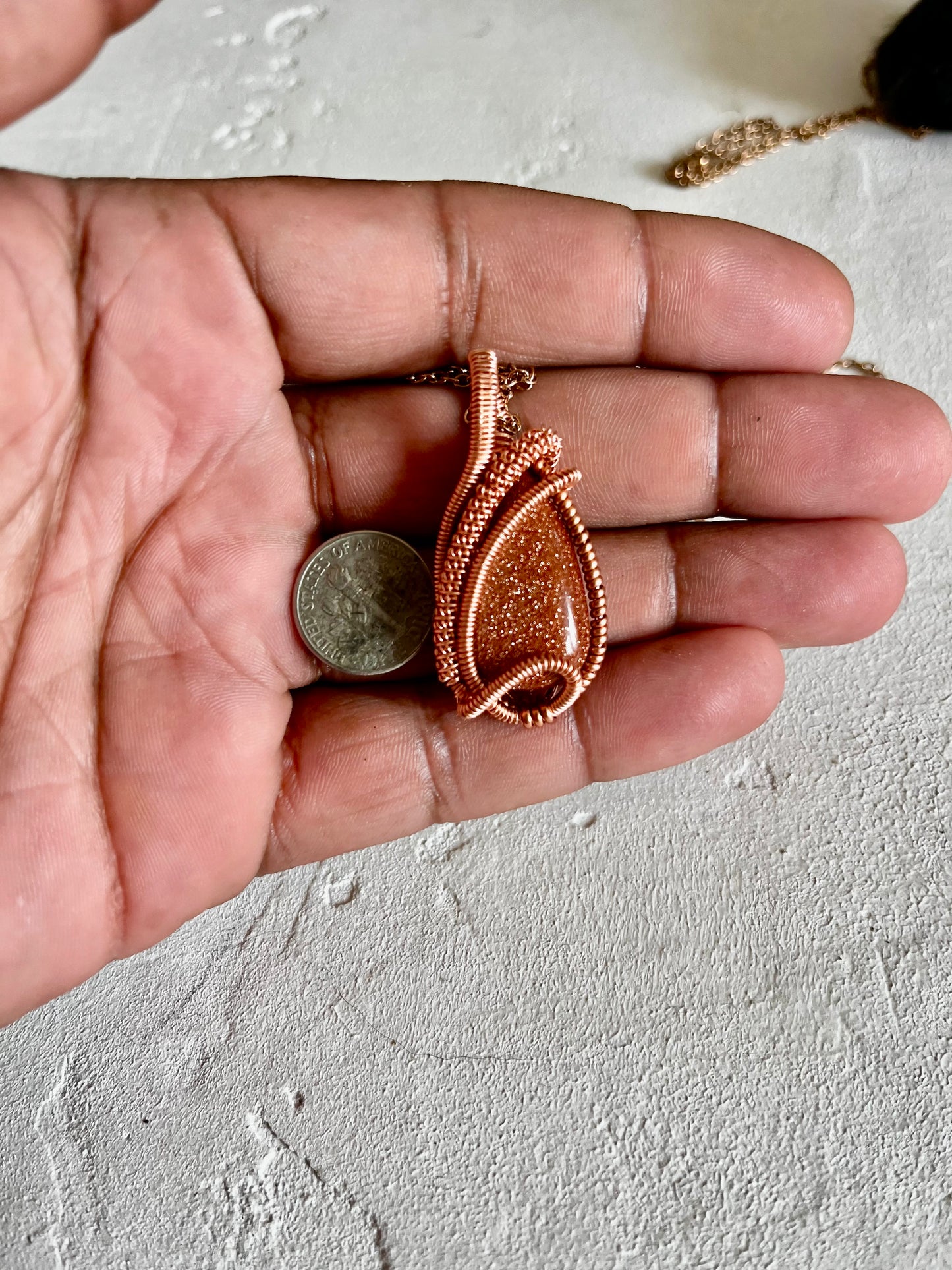 Gold stone pendant